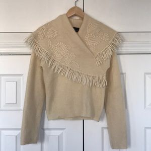 A vintage knit, flamboyant collar sweater.